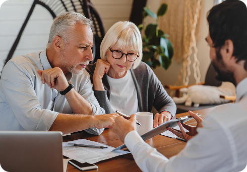 Professional & financial services - financial advisor speaking with a couple