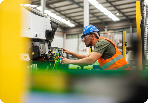 Advanced manufacturing & computing - robotics technician inspecting a robot